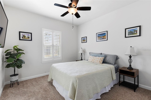 bedroom with light carpet and ceiling fan