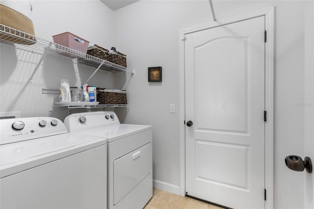 laundry room with separate washer and dryer