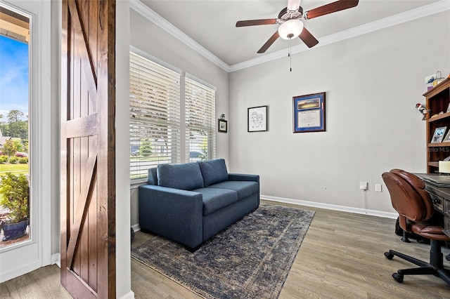 office with ceiling fan, wood-type flooring, and crown molding