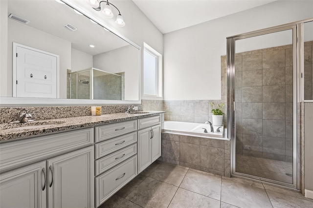 bathroom featuring separate shower and tub, tile patterned flooring, and vanity