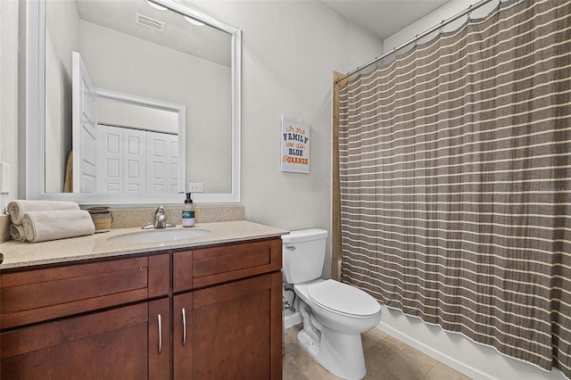 full bathroom with tile patterned floors, vanity, shower / tub combo, and toilet