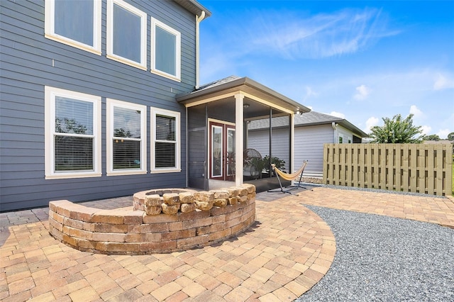 view of patio featuring french doors and an outdoor fire pit