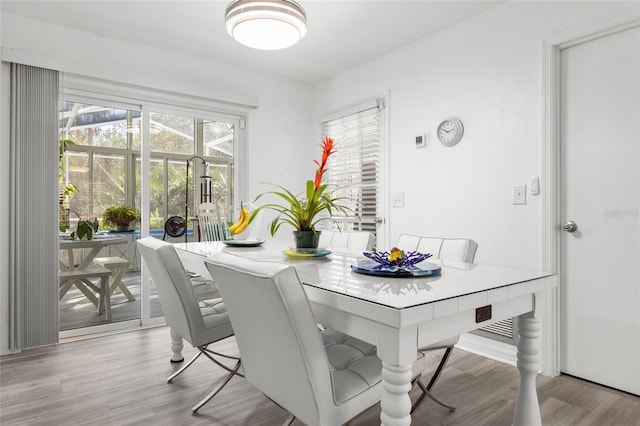 dining area with light wood-style floors