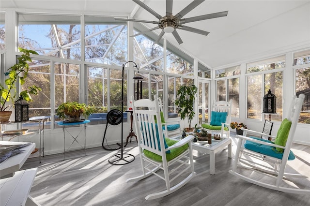 sunroom featuring a ceiling fan and vaulted ceiling