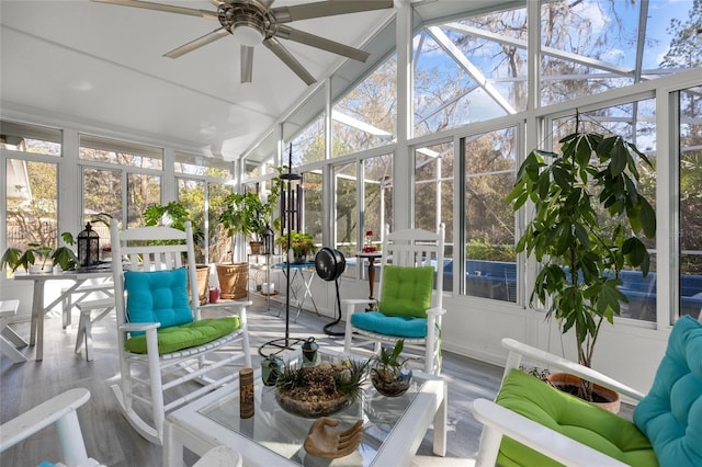 sunroom with a healthy amount of sunlight, ceiling fan, and vaulted ceiling