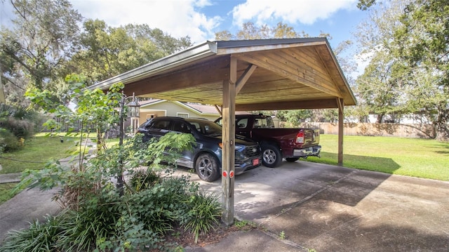 view of parking / parking lot with a carport and a yard