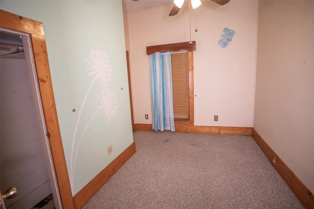 unfurnished bedroom featuring ceiling fan, a closet, and light colored carpet