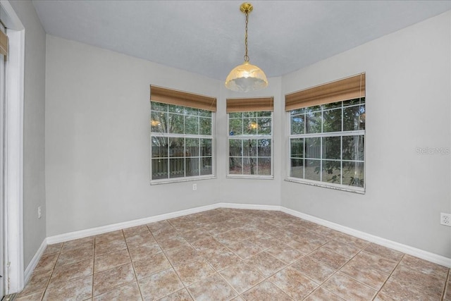 unfurnished room featuring tile patterned flooring