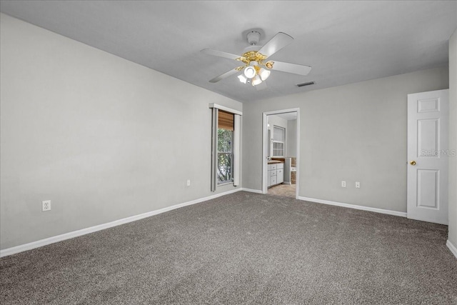 unfurnished bedroom with carpet flooring, ensuite bath, and ceiling fan