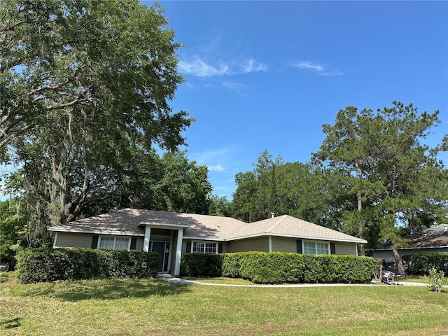 10620 NW 61st Ter, Alachua, FL 32615 - ranch-style home with a front lawn