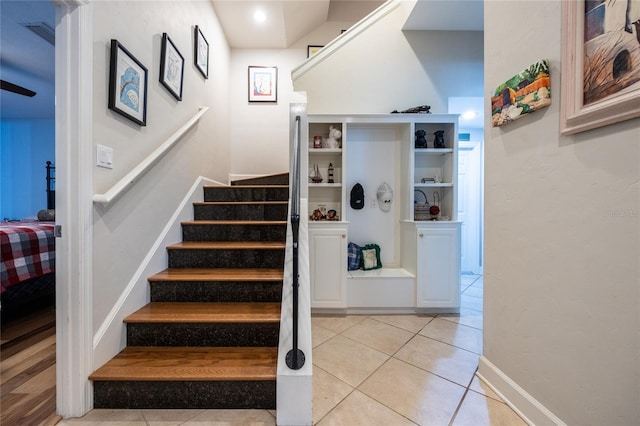 stairs featuring tile patterned floors