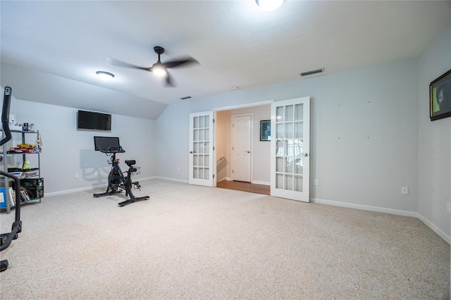 exercise area with ceiling fan, vaulted ceiling, carpet floors, and french doors