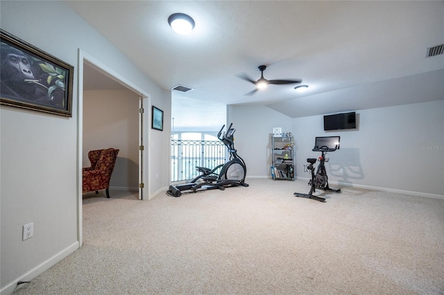 exercise room with ceiling fan, carpet, and vaulted ceiling