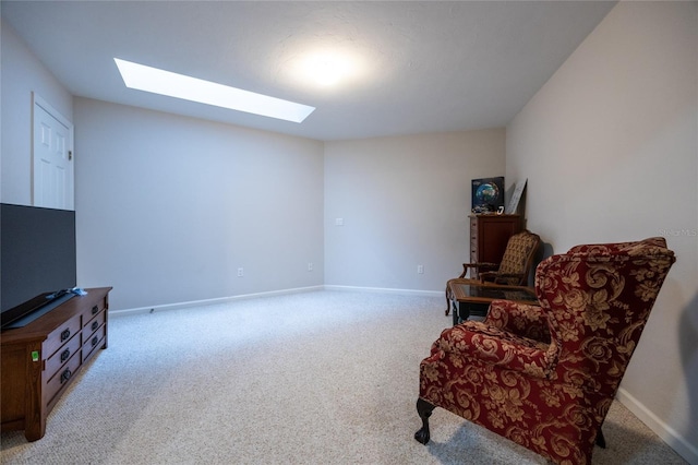 living area featuring light carpet