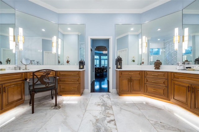 bathroom with vanity, a shower with door, and crown molding