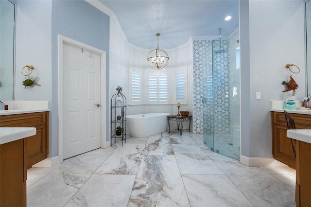 bathroom with vanity, crown molding, plus walk in shower, and an inviting chandelier