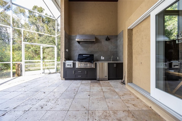 view of patio / terrace featuring area for grilling, sink, and exterior kitchen