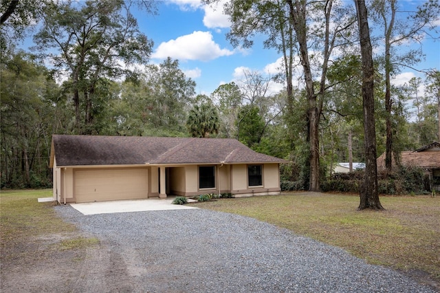 view of front facade with a garage and a front lawn