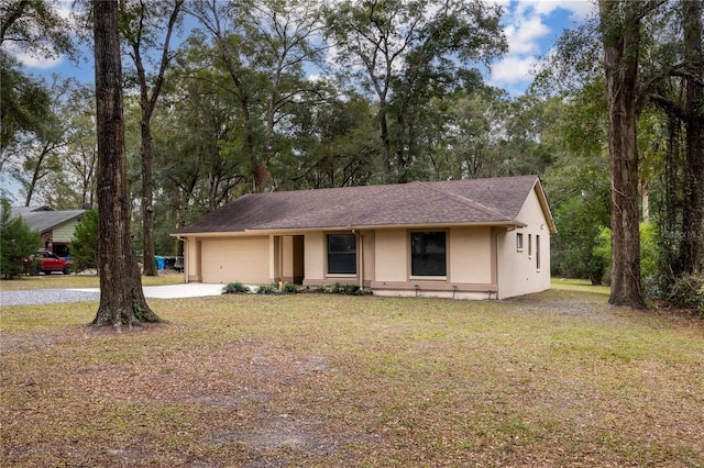 view of front facade featuring a garage and a front lawn