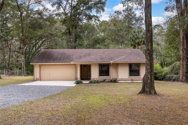 view of front of house with a garage and a front yard