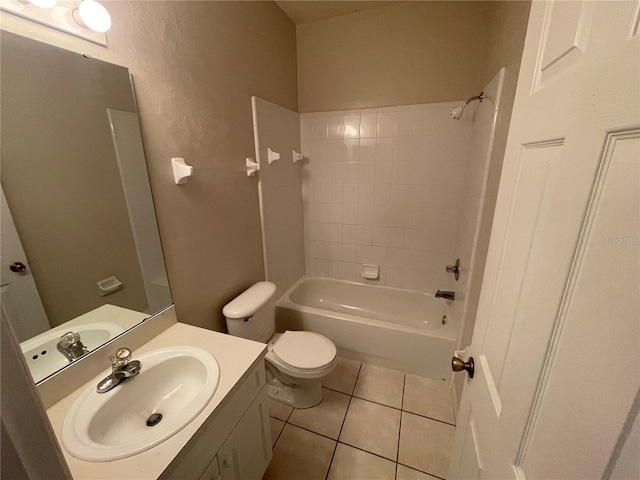 full bathroom featuring tile patterned floors, tiled shower / bath combo, toilet, and vanity