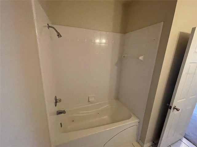 bathroom featuring tile patterned flooring and shower / bathing tub combination