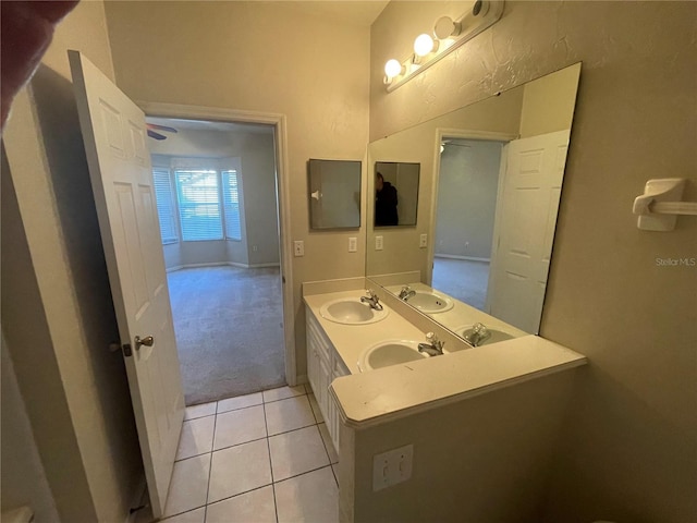 bathroom with tile patterned flooring and vanity