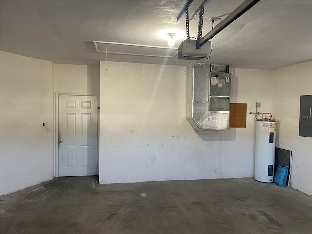 garage featuring electric panel and electric water heater