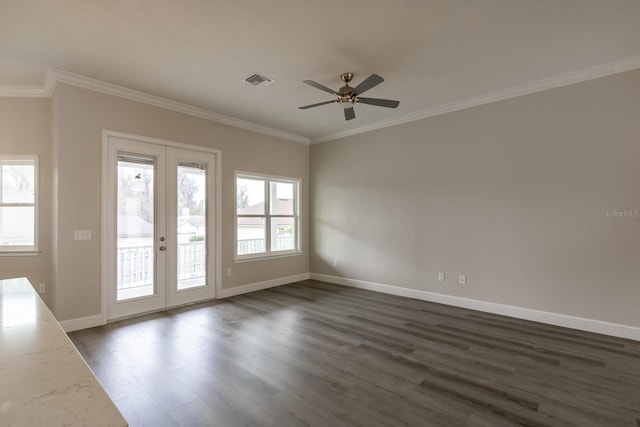 unfurnished room with ceiling fan, dark hardwood / wood-style flooring, ornamental molding, and french doors