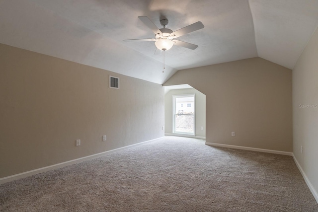 bonus room with carpet floors, ceiling fan, and lofted ceiling