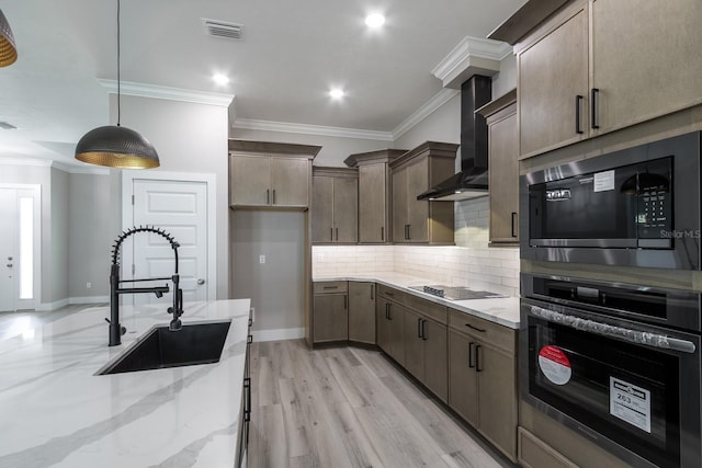 11828 NW 15th Rd, Gainesville, FL 32606 - kitchen featuring a sink, crown molding, light stone countertops, wall chimney exhaust hood, and black appliances