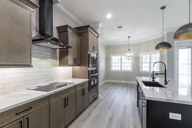11828 NW 15th Rd, Gainesville, FL 32606 - kitchen with wall chimney exhaust hood, black electric cooktop, light wood finished floors, wall oven, and a sink