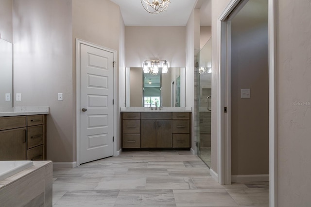 11828 NW 15th Rd, Gainesville, FL 32606 - bathroom with a sink, two vanities, a chandelier, and a stall shower