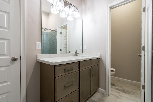 11828 NW 15th Rd, Gainesville, FL 32606 - full bathroom featuring toilet, vanity, a stall shower, and baseboards