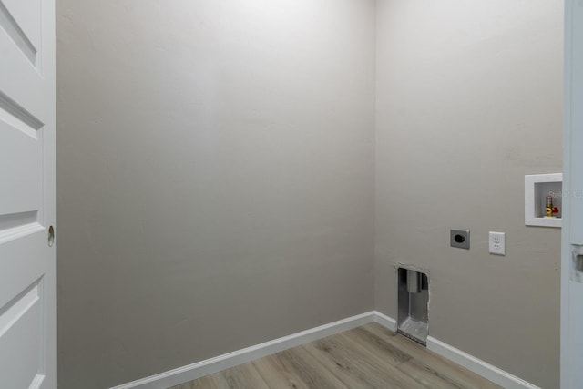 11828 NW 15th Rd, Gainesville, FL 32606 - washroom featuring hookup for an electric dryer, baseboards, light wood-type flooring, washer hookup, and laundry area