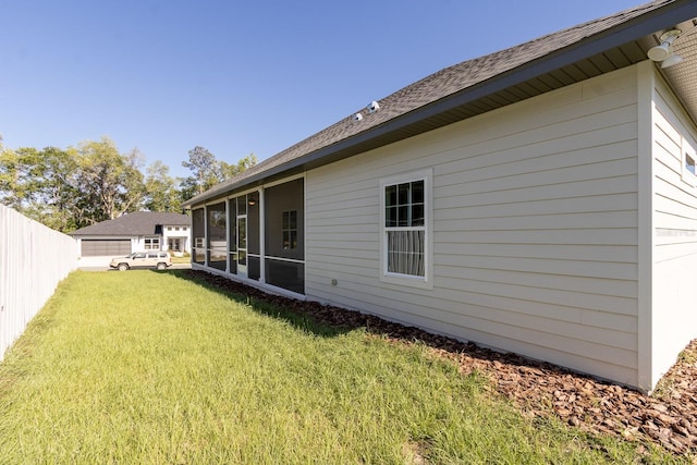 11828 NW 15th Rd, Gainesville, FL 32606 - back of house featuring a sunroom, a yard, and fence