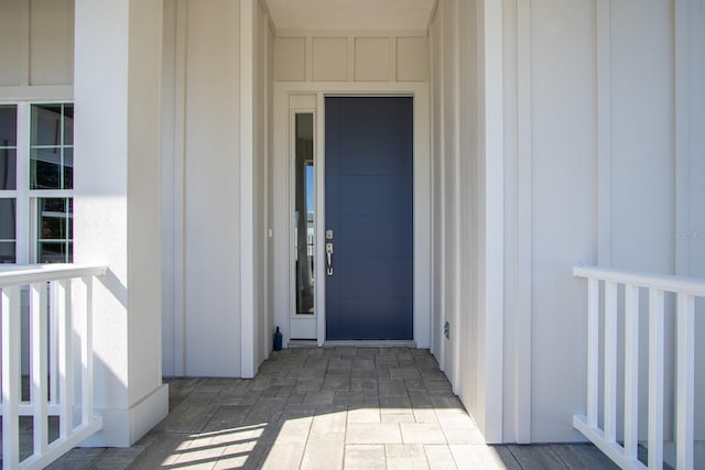 11828 NW 15th Rd, Gainesville, FL 32606 - doorway to property with board and batten siding