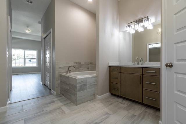 11828 NW 15th Rd, Gainesville, FL 32606 - full bathroom with a bath, baseboards, and vanity