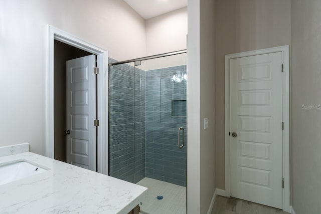11828 NW 15th Rd, Gainesville, FL 32606 - full bath with a stall shower, vanity, and baseboards