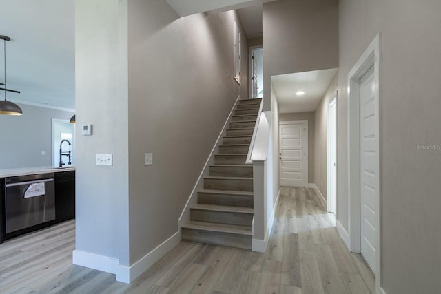 11828 NW 15th Rd, Gainesville, FL 32606 - stairway featuring baseboards and wood finished floors