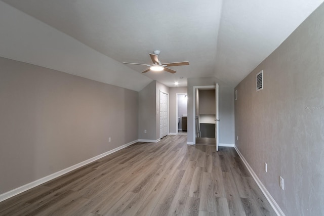 11828 NW 15th Rd, Gainesville, FL 32606 - interior space with baseboards, light wood-type flooring, a ceiling fan, visible vents, and lofted ceiling