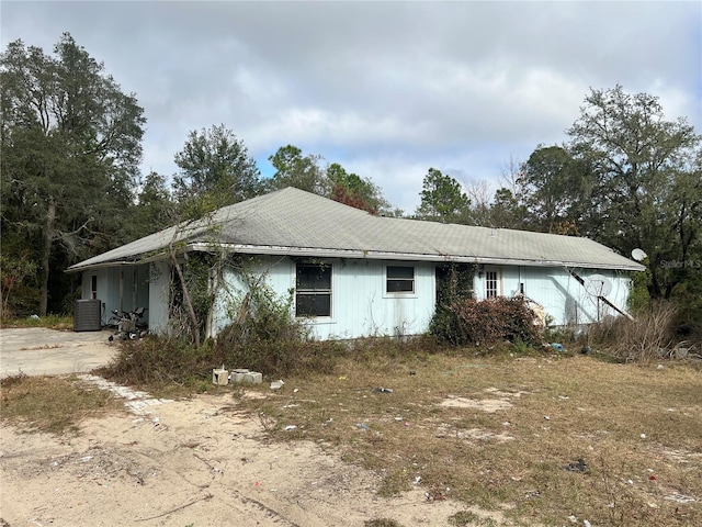 view of property exterior with central AC