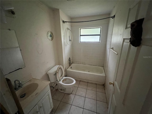 full bathroom with toilet, tile patterned flooring, tiled shower / bath, and vanity