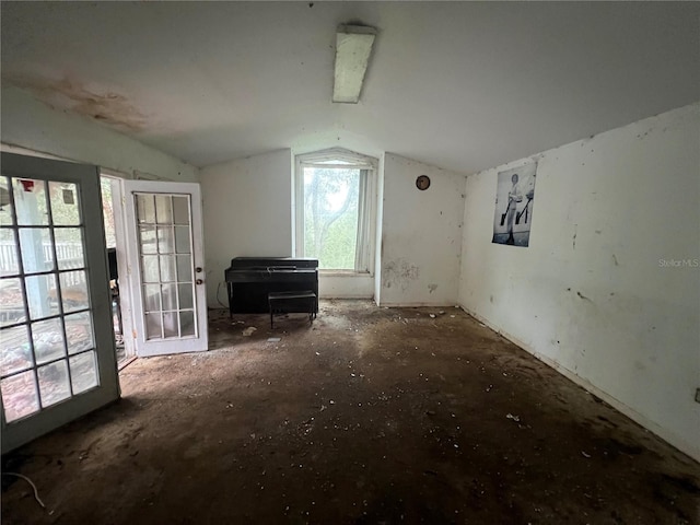 additional living space featuring vaulted ceiling