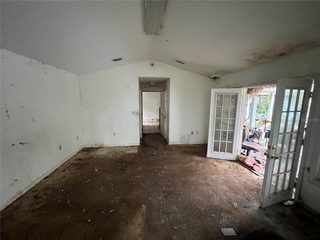 miscellaneous room with lofted ceiling and french doors