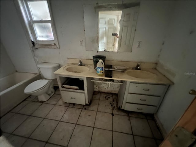 bathroom featuring tile patterned floors, vanity, and toilet