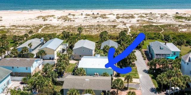 bird's eye view featuring a view of the beach and a water view