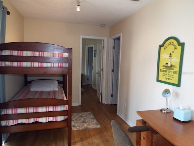 bedroom with hardwood / wood-style flooring