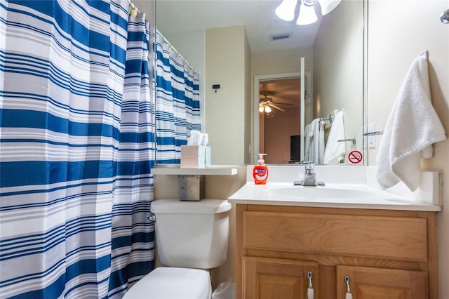 bathroom with vanity, ceiling fan, and toilet