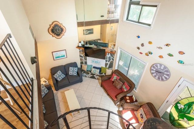 living room featuring tile patterned floors and a high ceiling